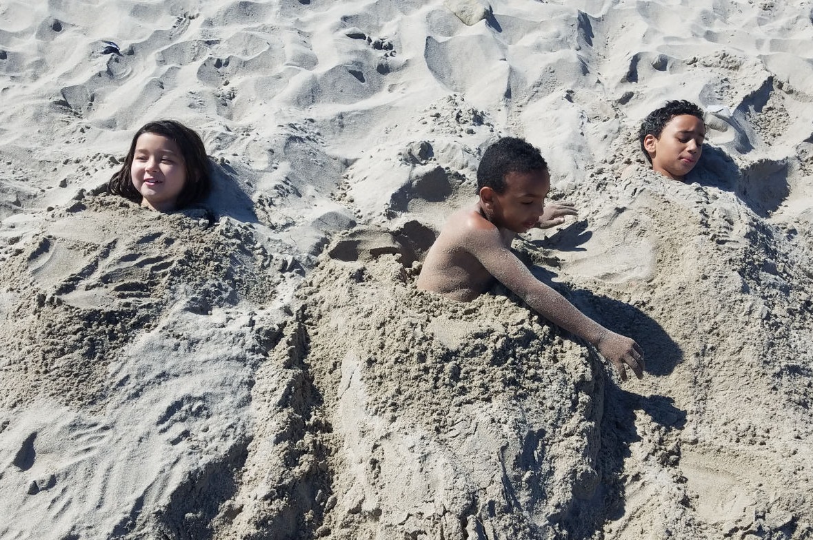 11 Ways to Summer in L.A. | kids enjoying being buried in the sand